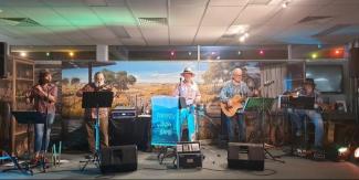 Paverty Bush Band members playing